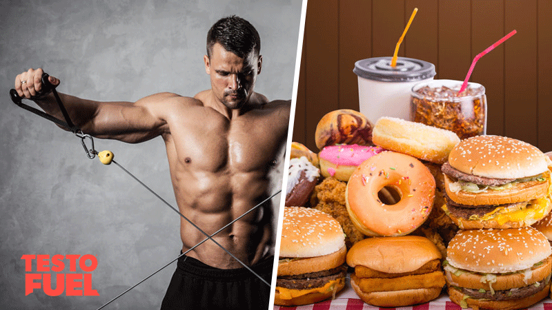 Muscular man lifting weights and a table full of junk foods
