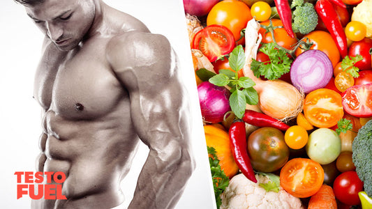 A range of healthy foods laid out on a table while a muscular man looks on