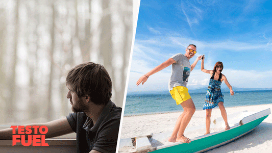 A man and a woman have fun on the beach in the sun while another man stis at a window sad and depressed
