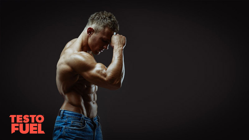 Muscular bodybuilder on black background