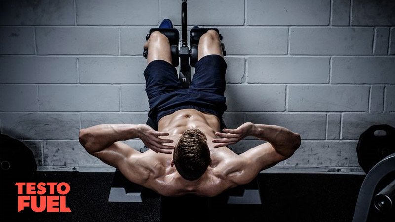 Man doing sit-ups workout to boost testosterone