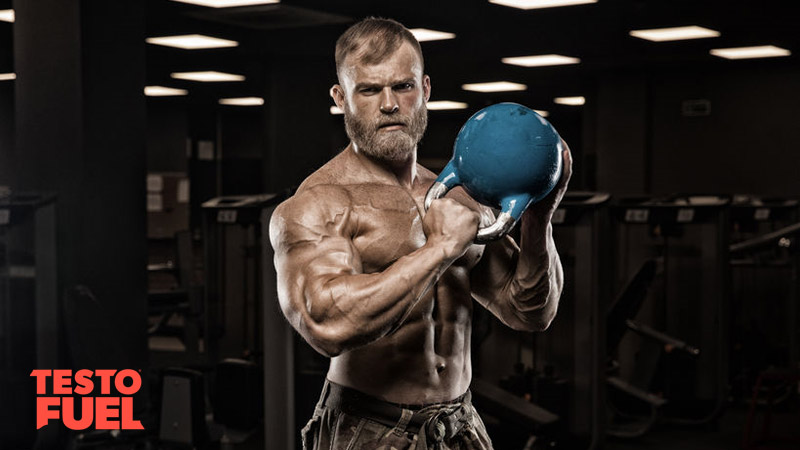 Muscular man with testosterone booster and kettlebell