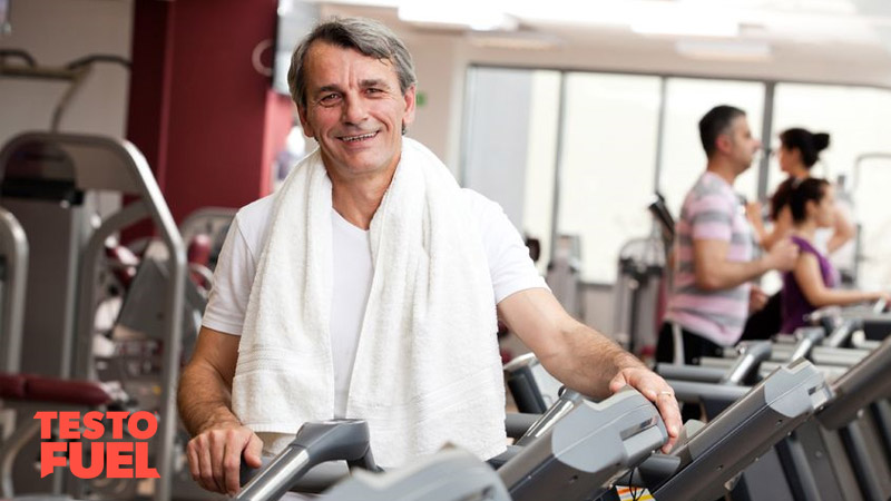 Older man with hypogonadism training in the gym