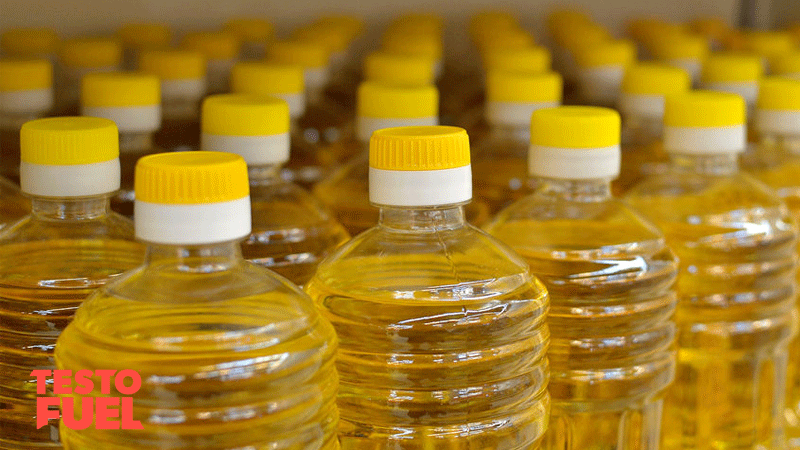 Clear bottles with yellow lids full of vegetable oil