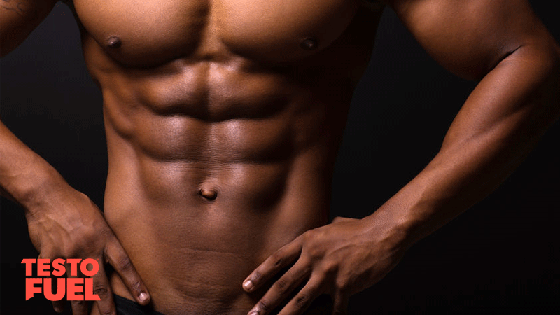 African man showing his six pack abs and chiseled muscles