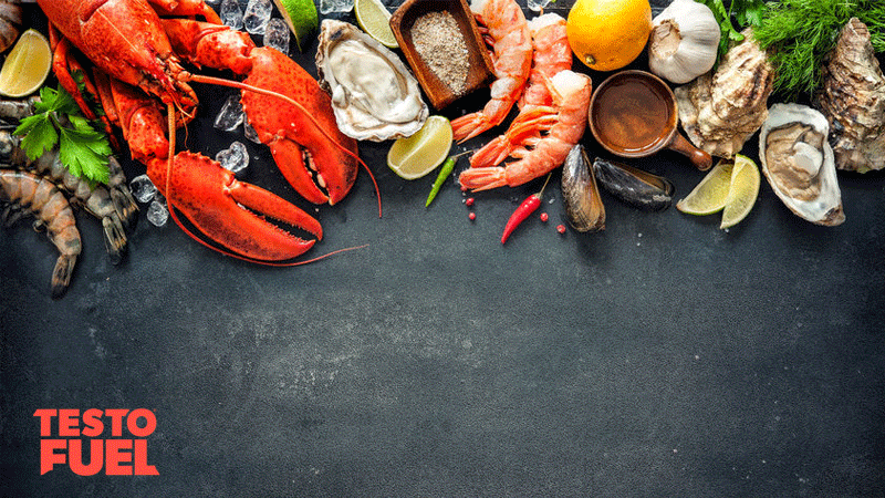 A range of shellfish and oyster foods on a dark grey table