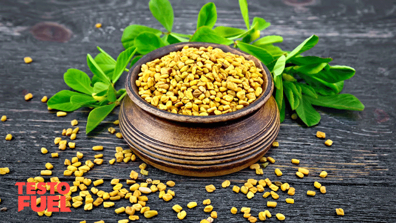 A wooden bowl of fenugreek seeds on a dark grey table